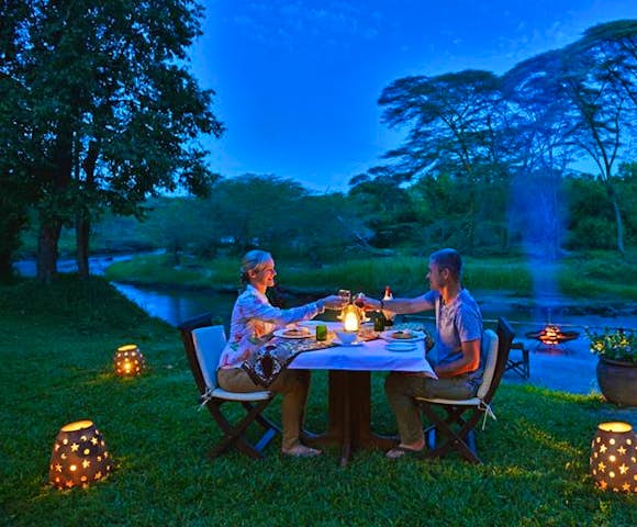 Outdoor dining at Ishasha Wilderness Camp.