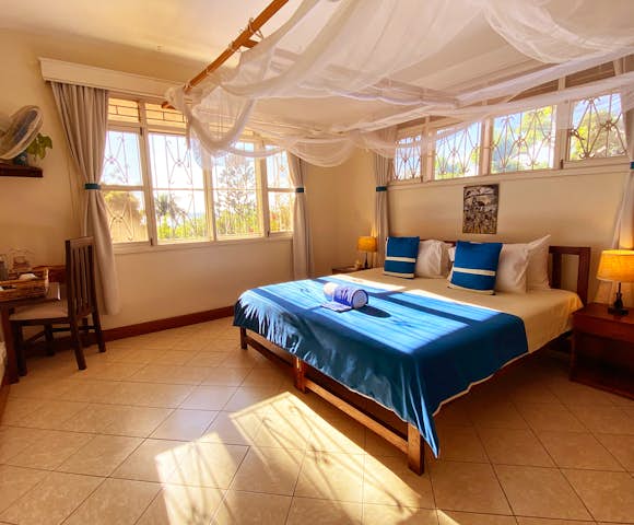 Comfortable, spacious room at Karibu Guesthouse Entebbe.