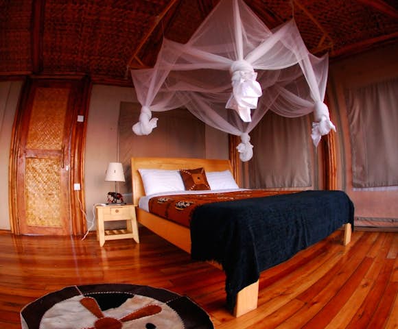 Spacious bedroom of a banda at Marafiki Safari Lodge.